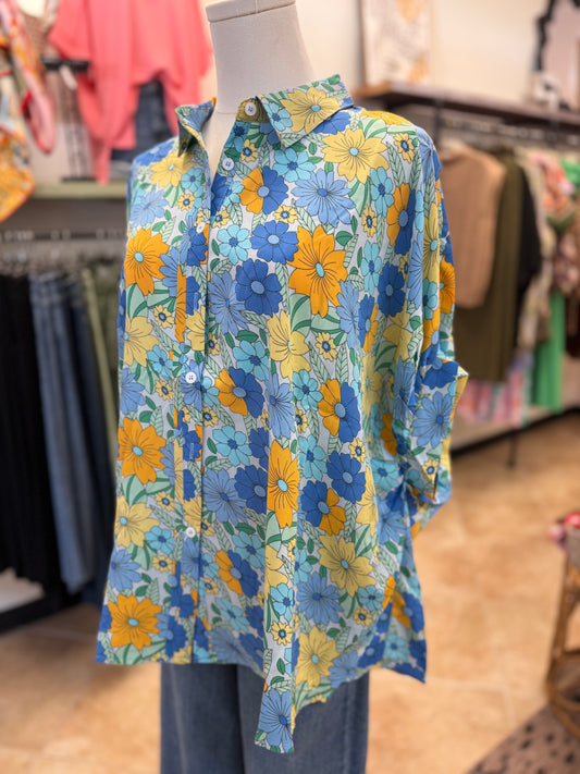 Colorful blue floral button up blouse and jeans