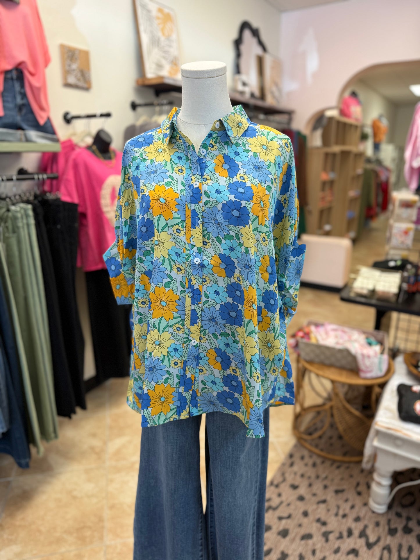 Colorful blue floral button up blouse and jeans